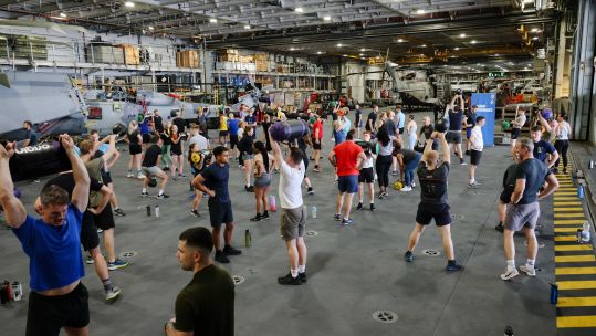 Members of HMS Queen Elizabeth's crew taking part in fitness initiative onboard the ship