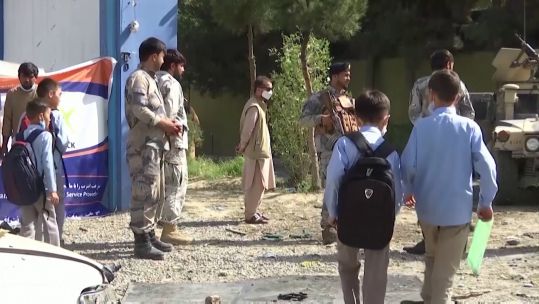 Members of the Afghan military alongside civilians in the country 