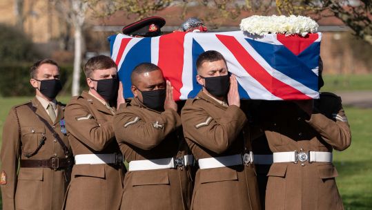 Members of the Armed Forces lift Captain Sir Tom Moore's coffin into the crematorium for his funeral 270221 CREDIT PA - NOTE NO REUSE AFTER 6 MARCH 2021