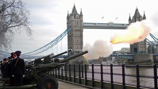 Members of the Honourable Artillery Company fire a gun salute from the wharf at the Tower of London to mark the Queen's Platinum Jubilee