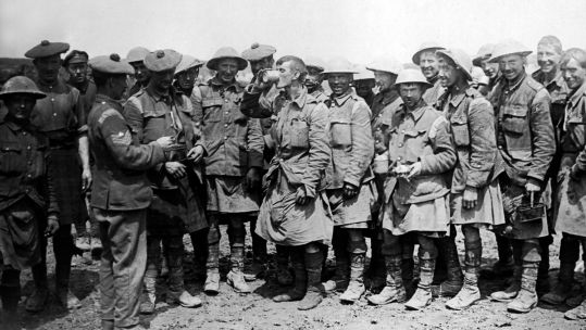 Men of the Black Watch enjoying an issue of rum on the Western Front during the First World War (Picture: Chronicle / Alamy Stock Photo).