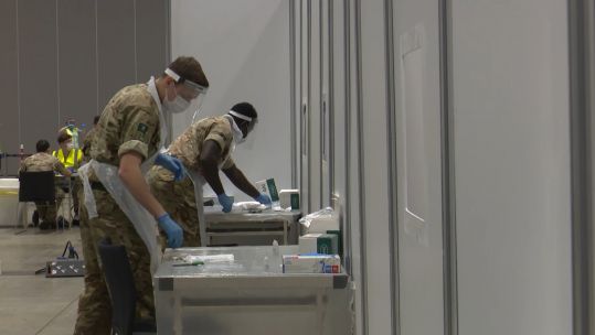 Cover image: Troops at a testing centre in Liverpool.