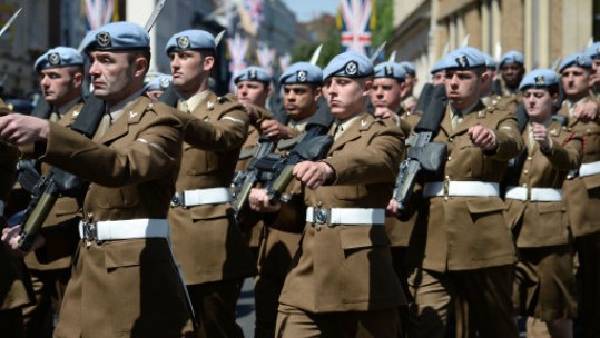 Military personnel march through Windsor during the Royal wedding rehearsal (Picture: PA).