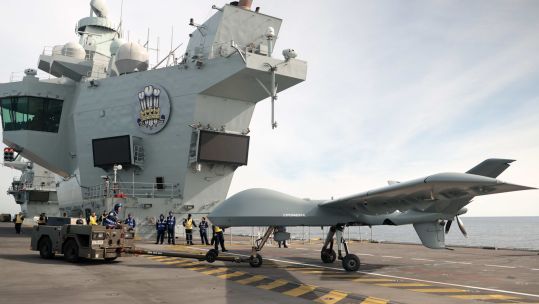 Mojave aircraft taken back to hangar following succesful trial on HMS Prince of Wales (Picture: Royal Navy).