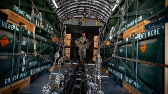 An airman with the 305th Aerial Port Squadron uploads munitions onboard a C-17 Globemaster III at Joint Base McGuire-Dix-Lakehurst, N.J. The munitions cargo is part of an additional security assistance package for Ukraine CREDIT DOD