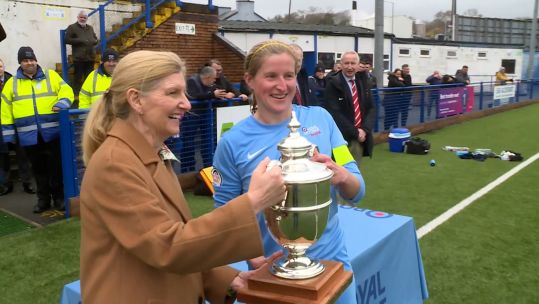 Cat Beaver accepts Inter Services trophy for the RAF