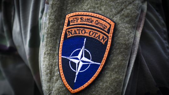 NATO-OTAN badge on anonymous uniform 040820 CREDIT PA