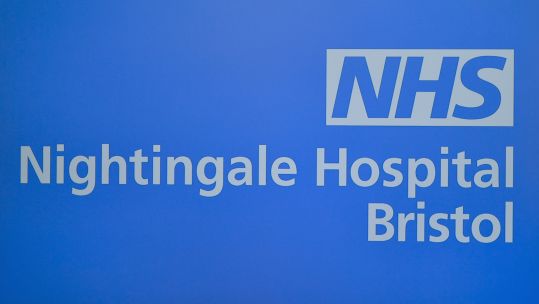 An electronic display showing the name of the NHS Nightingale Hospital Bristol (Picture: PA).