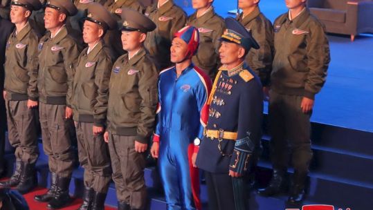 Close up of North Korean soldier in blue outfit