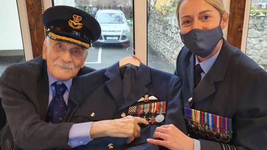 New Uniform Xmas gift delivered to Last Battle of Britain pilot Capt Hemingway 21122021 CREDIT RAF