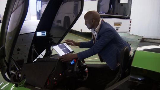 New owner of RAF Neatishead tech entrepreneur William Sachiti with KAR-GO, a self-driving electric vehicle