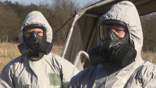Royal Marines in protective masks and suits on Exercise Toxic Dagger