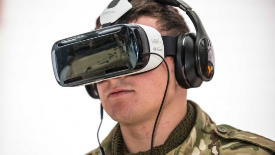 A soldier demonstrates a virtual reality headset in 2015 (Picture: Crown Copyright).