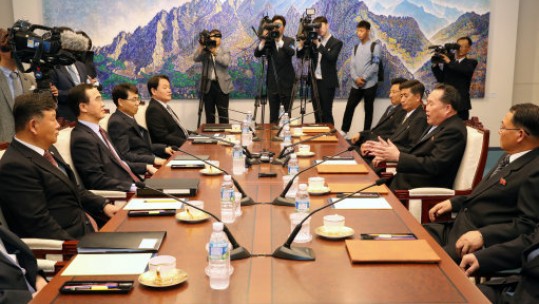Officials from the Koreas speak at Panmunjom (Picture: PA).