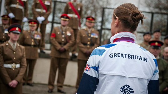 Olympic Gold Medallist welcomed to ‘Army Music HQ’ Captain Heather Stanning RA received a ‘fanfare’ welcome to Kneller Hall, home to the Corps of Army Music (CAMUS) and Royal Military School of Music. 281112 CREDIT MOD.png