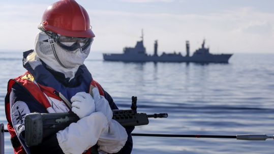 Cover image: Sailor on board HMS Albion as  tanker ESPS Patino sails past in the background (Picture: Royal Navy).