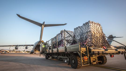 Cover image: An oxygen tank is loaded onto the RAF aircraft (Picture: MOD).