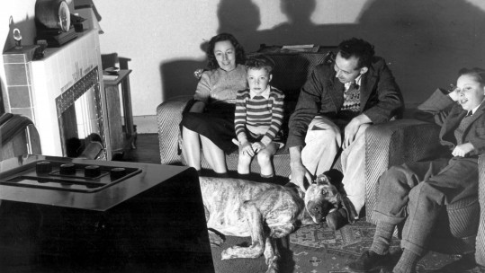 Family watching television in the 1950's