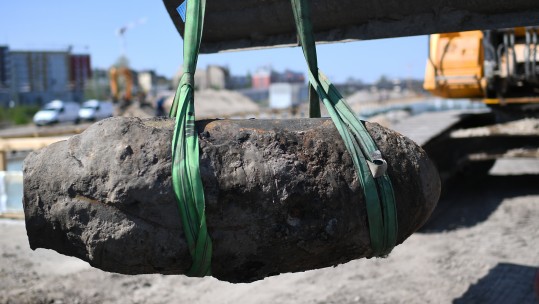  Britta Pedersen/DPA/PA Image. 20 April 2018, Germany, Berlin: A crane lifts a defused WWII bomb 