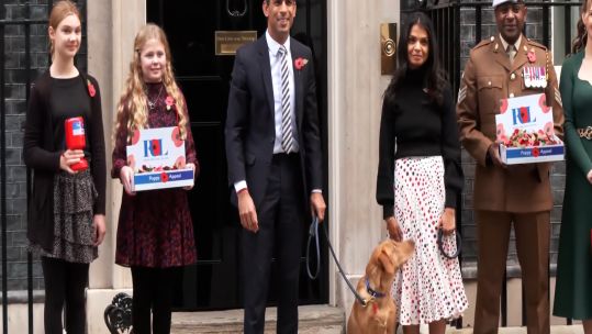 PM Rishi Sunak with wife Akshata Murthy and dog Nova alongside members of Poppy Appeal outside No 10 Downing St 311022 CREDIT POOL