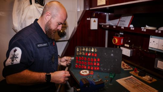 PO Andy Kirkaldy turning shell casings into poppies for shipmates on HMS Sutherland 261020 CREDIT ROYAL NAVY