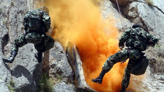 Two members of the Pakistan Special Forces Group the SSG, or Special Service Group, rappelling down a cliff during  a training exercise