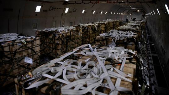 Pallets of ammunition, weapons and other equipment bound for Ukraine are secured onto a plane 22022022 CREDIT US Dept of Defence