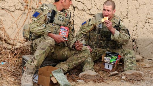 Personnel from the Parachute Regiment eating the 12 hour ORP in Afghanistan.