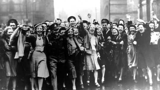 People celebrate VE Day in Manchester in 1945 (Picture: PA).