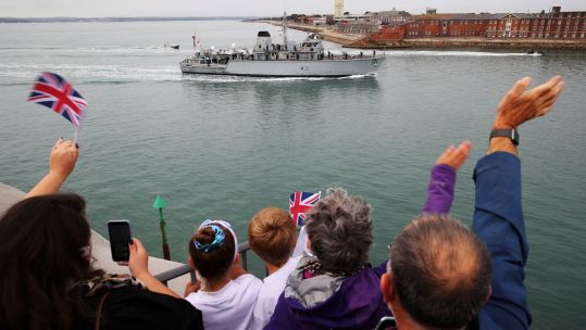 Cover image: People wave as HMS Ledbury arrived back in Portsmouth (Picture: Royal Navy).