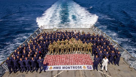 Personnel aboard HMS Montrose having seized £11m worth of drugs in the North Arabian Sea