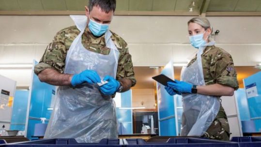 Personnel assisting with coronavirus testing at Gresley Old Hall, Derbyshire (Picture: MOD).