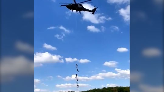 Personnel from the Royal Irish Regiment practicing a SPIES extraction from a helicopter