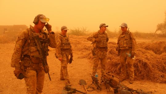 Personnel in Mali conducting an operation that seized a weapons cache from an IS-affiliated group in the country
