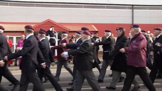 Personnel marching in Aldershot to mark 50 years since the bombing of the 16th Parachute Brigade Officers' Mess