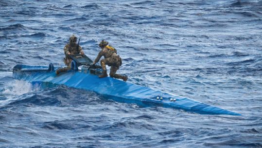 Personnel on the top of a 'narco-submarine', from which HMS Trent seized £160m of cocaine 120924 CREDIT Royal Navy