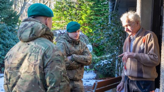 Personnel speaking to an elderly resident amid Storm Arwen aftermath and assistance December (Picture: MOD).