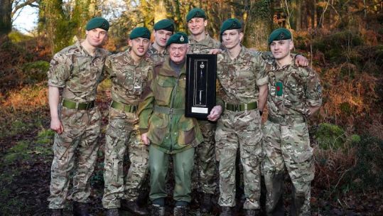 Peter White Royal Marine legend poses with royal marines