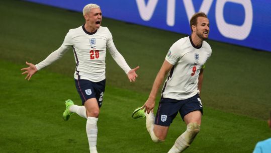 Phil Foden and Harry Kane celebrate England's second goal against Denmark in their Euro 2020 semi-final at Wembley Stadium