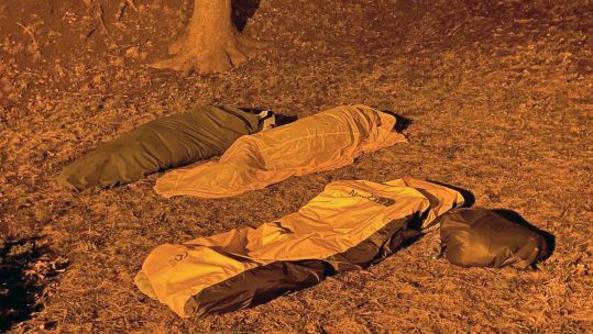 Photo of three British military veterans Dan Kaine Matt Hooper and Mike O'Halloran who travelled to Kyiv to sleep outside in sleeping bags to raise money