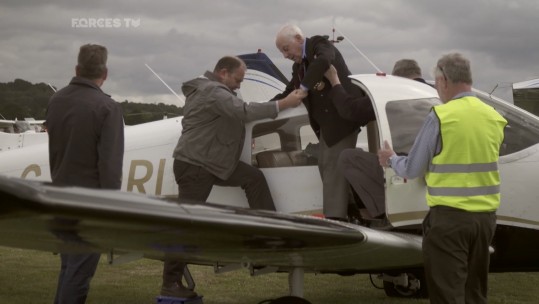Veterans arrive by plane.
