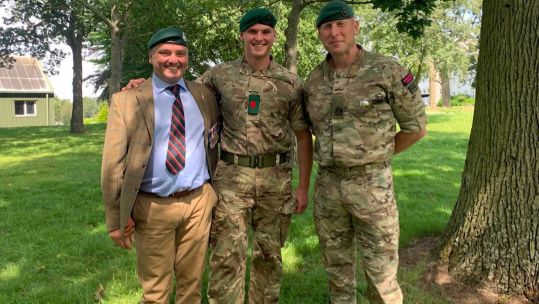 Picture of Lee Spencer having presented the green beret to his son Billy (Picture: Lee Spencer).
