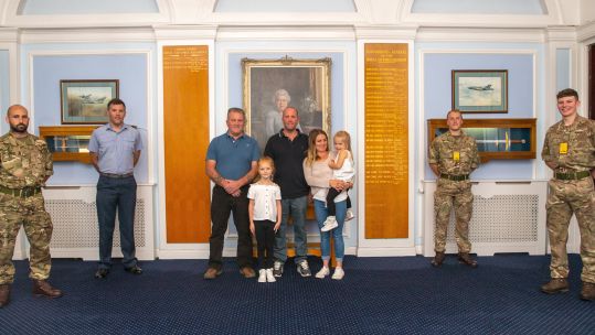 Pictured Darren Ruck with his family (centre) during his visit to RAF Honington to meet the personnel that potentially saved his life on 21st June 2020 270820 CREDIT MOD