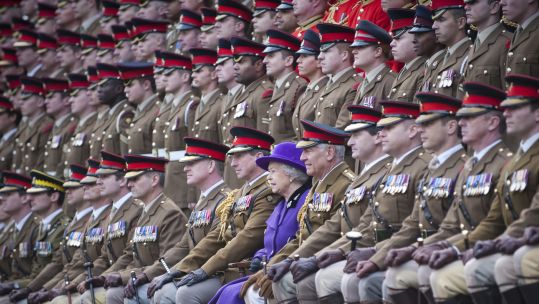Pictured is The Queen being photographed with the soldiers of the Household Cavalry Regiment and the Household Cavalry Mounted Regiment
