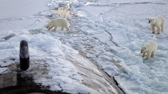 Submarine surfaces through ice