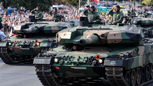 Polish servicemen parade Leopard 2PL tanks on Polish Army Day 