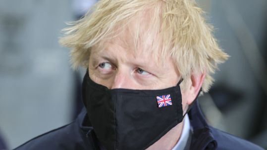A close up of Boris Johnson during his tour of HMS Queen Elizabeth in Portsmouth in May (Picture: Downing Street).