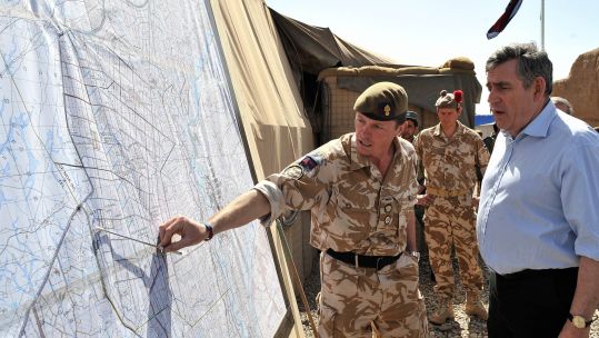Prime Minister Gordon Brown is shown a map of Helmand Province by lieutenant colonel Roly Walker 