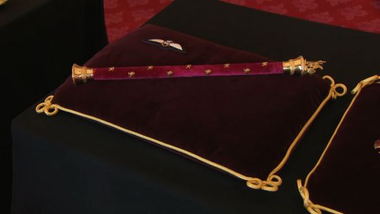 Prince Philip's RAF wings and Field Marshal baton on cushion for alter display ahead of his funeral 150421 CREDIT POOL