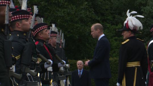 Prince William speaks to personnel at the Ceremony of the Keys in Edinburgh.